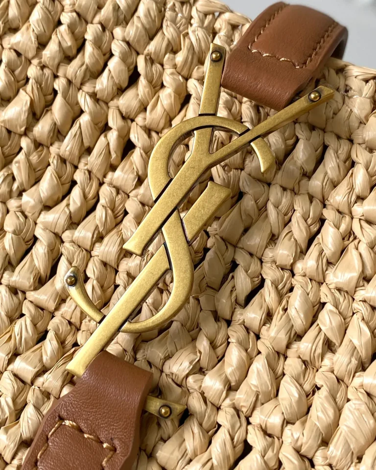 Straw-Tone Woven Bucket Bag with Tan Trim — logo detail view